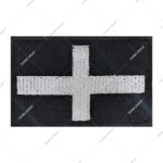 Christian flag patch featuring a white embroidered cross on a black background